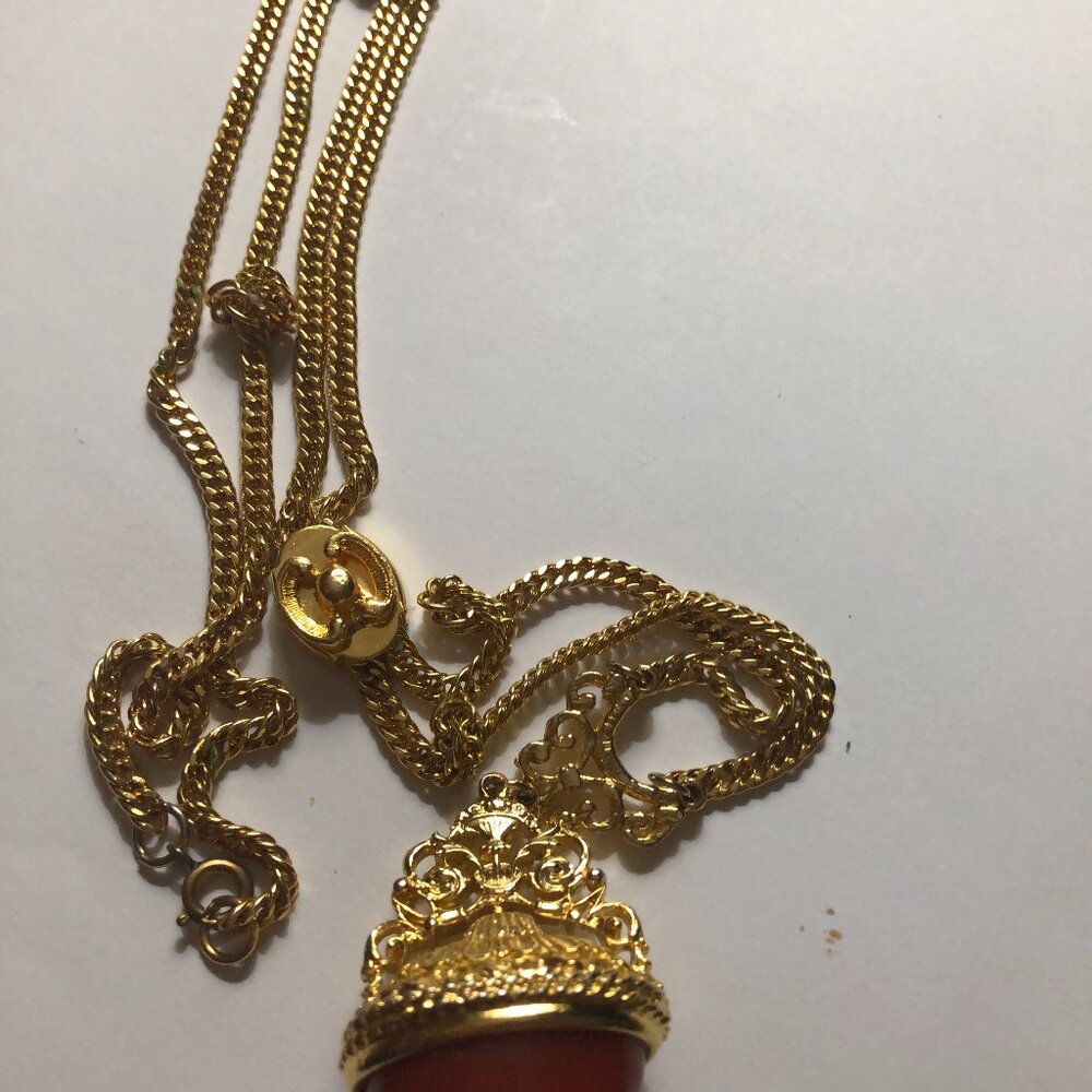 Vintage gold tone slider necklace with gold tone pendant and amber stone